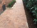 National Park Street Merewether: Paved pathways and patio areas. Sandstone garden edges. Timber steps, garden soils, Gardenias and pine bark